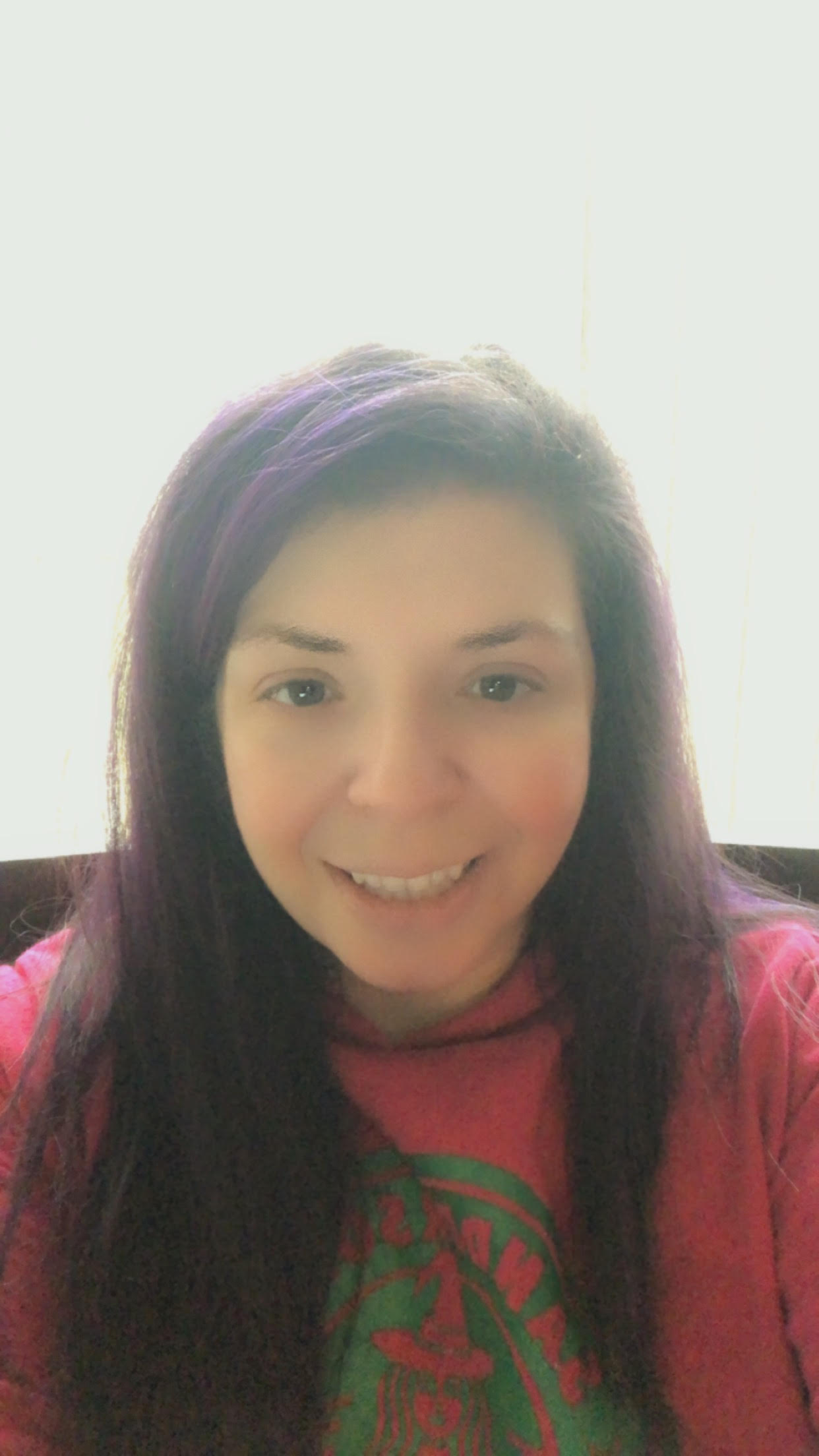 A picture of smiling librarian Ms. Lucia